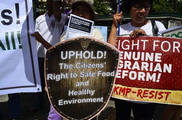 Protesters decry the government's haste in issuing new rules on GMOs and ignoring the precautionary principles, to the detriment of farmers, unsuspecting consumers, and other affected stakeholders.